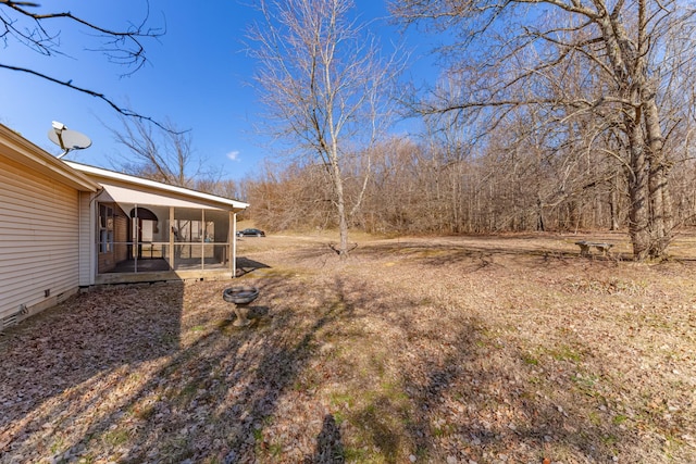 view of yard with a sunroom