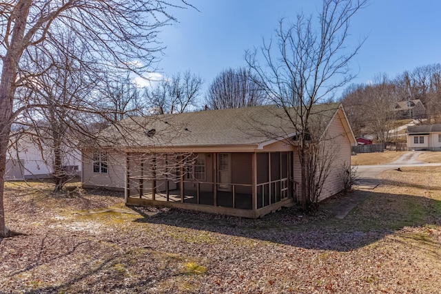 rear view of house with a sunroom