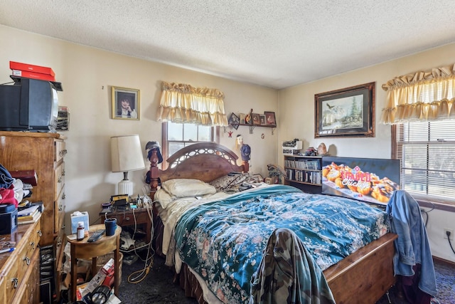 bedroom with carpet floors and a textured ceiling