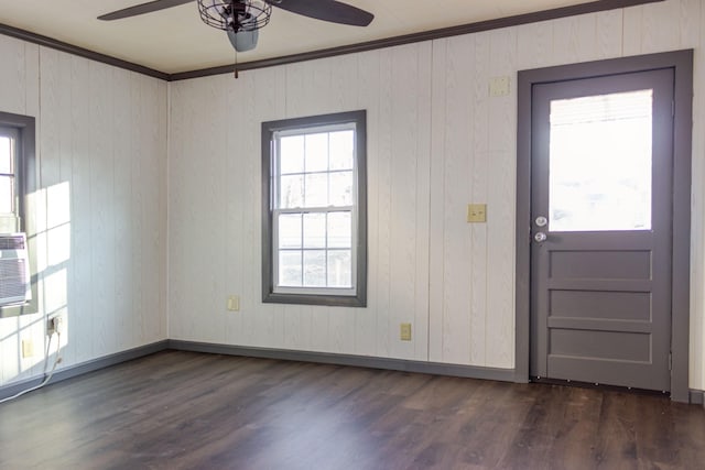 foyer featuring ceiling fan, ornamental molding, and dark hardwood / wood-style flooring