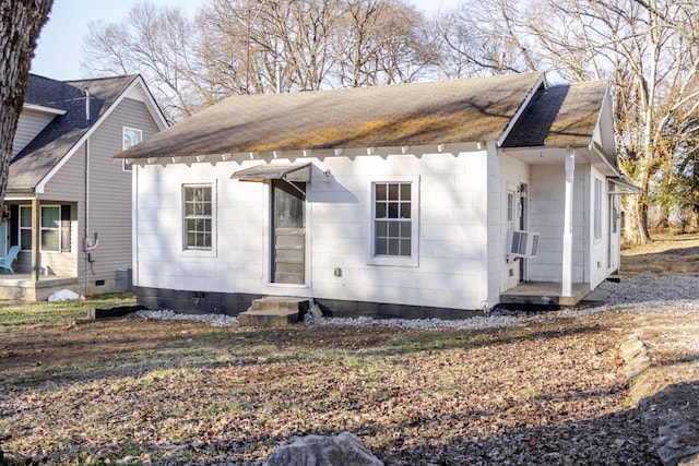 view of side of home featuring cooling unit