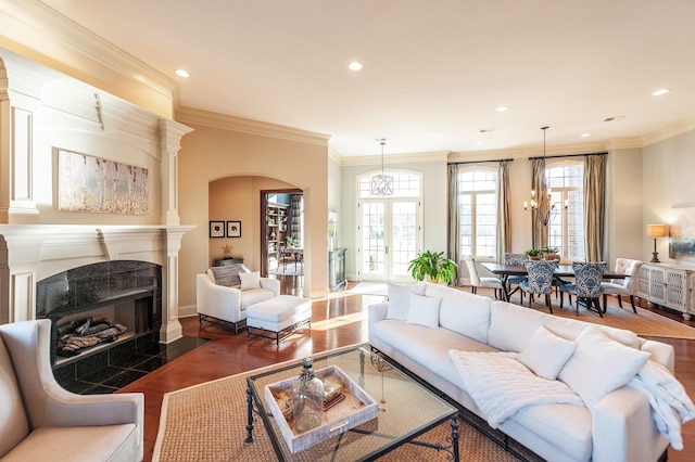 living room featuring ornamental molding and dark hardwood / wood-style floors