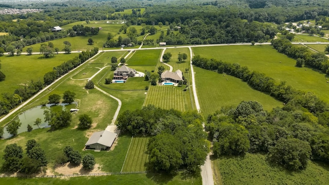 bird's eye view with a water view and a rural view