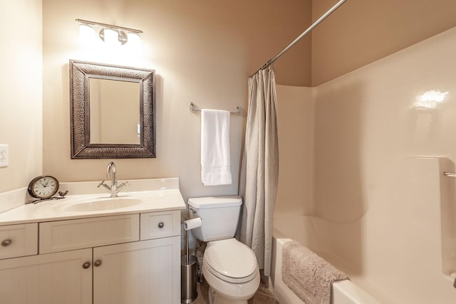 full bathroom with vanity, shower / tub combo, and toilet