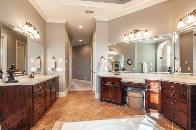 bathroom featuring tile patterned flooring, crown molding, and vanity