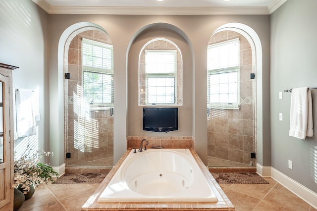 bathroom with tile patterned floors, ornamental molding, and separate shower and tub