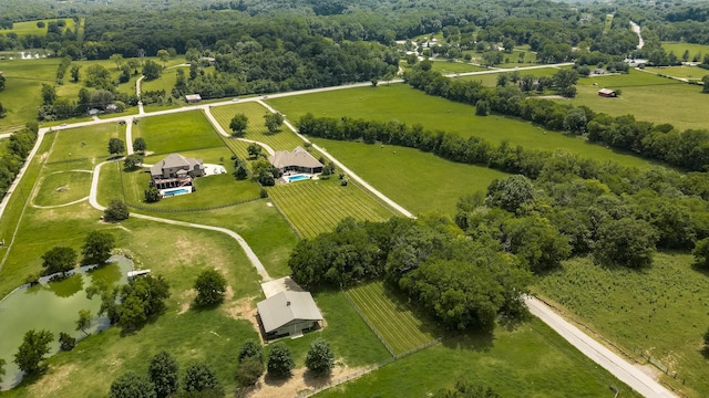 drone / aerial view featuring a water view and a rural view