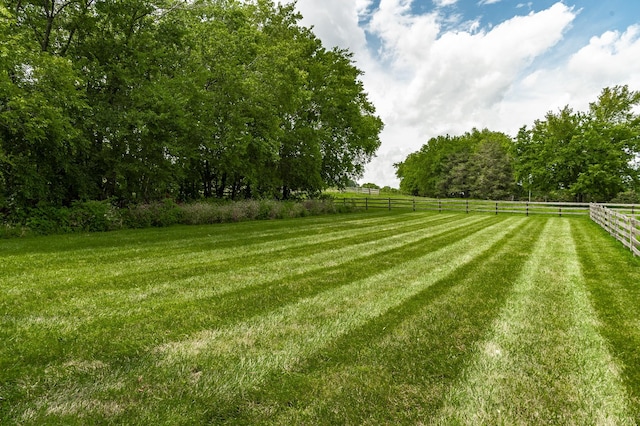 view of yard with a rural view