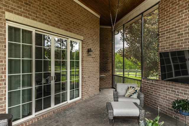 unfurnished sunroom with wood ceiling