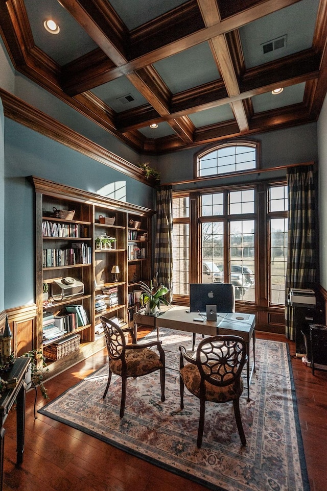 home office with crown molding, coffered ceiling, dark hardwood / wood-style flooring, and beam ceiling