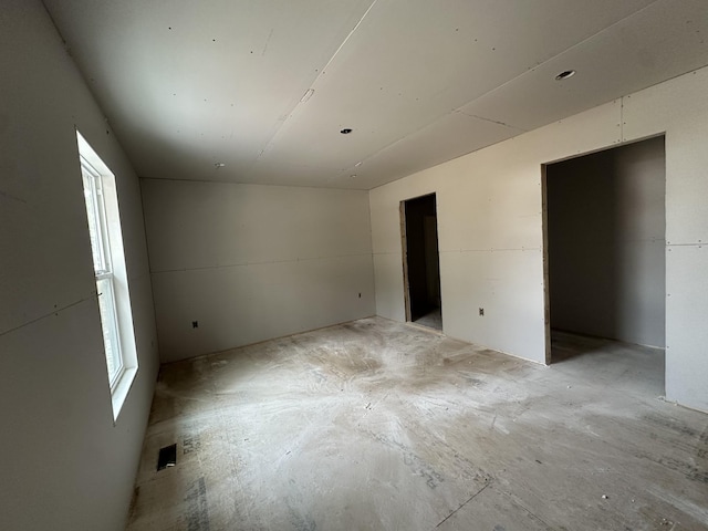 spare room featuring plenty of natural light