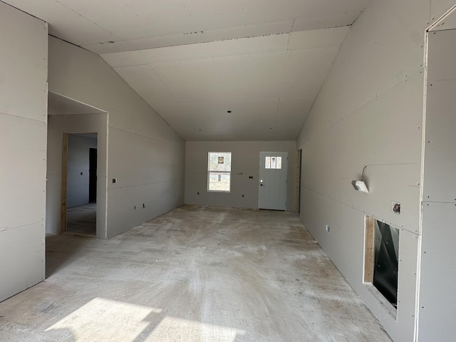 empty room with vaulted ceiling