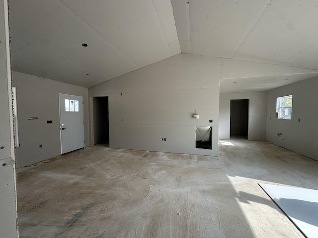 interior space with lofted ceiling and a healthy amount of sunlight