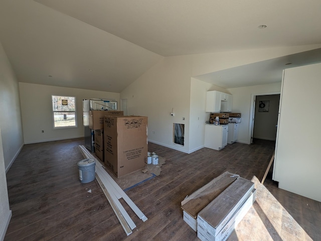 living area with vaulted ceiling, dark wood-style floors, and baseboards