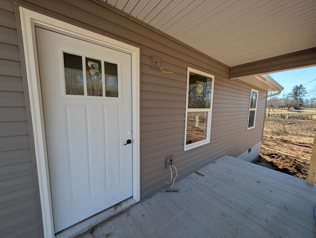 doorway to property featuring crawl space