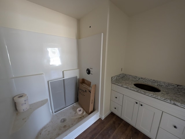 bathroom featuring vanity and wood finished floors