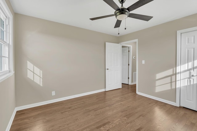 spare room featuring hardwood / wood-style flooring and ceiling fan