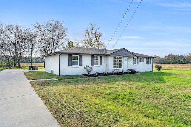 ranch-style home with a front lawn