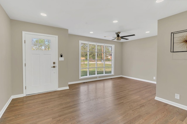 entrance foyer featuring a wealth of natural light, light hardwood / wood-style floors, and ceiling fan