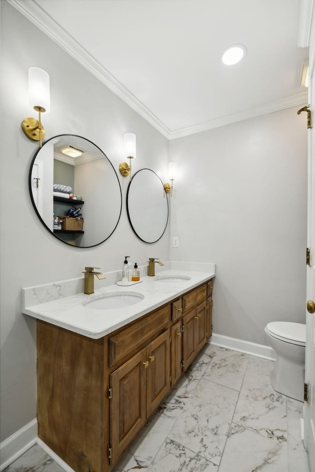 bathroom with ornamental molding, toilet, and vanity