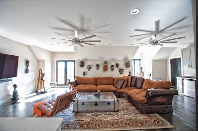 living room featuring french doors, ceiling fan, dark hardwood / wood-style floors, and vaulted ceiling