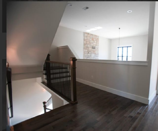 staircase featuring hardwood / wood-style floors