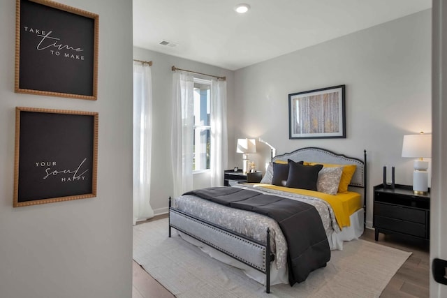 bedroom featuring hardwood / wood-style flooring