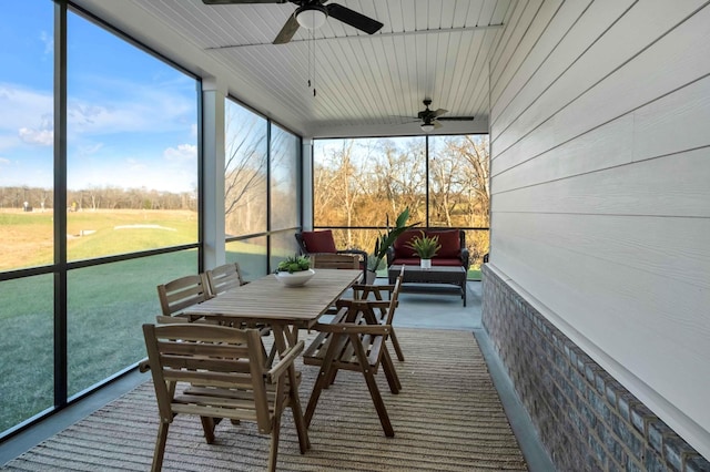 sunroom / solarium with ceiling fan