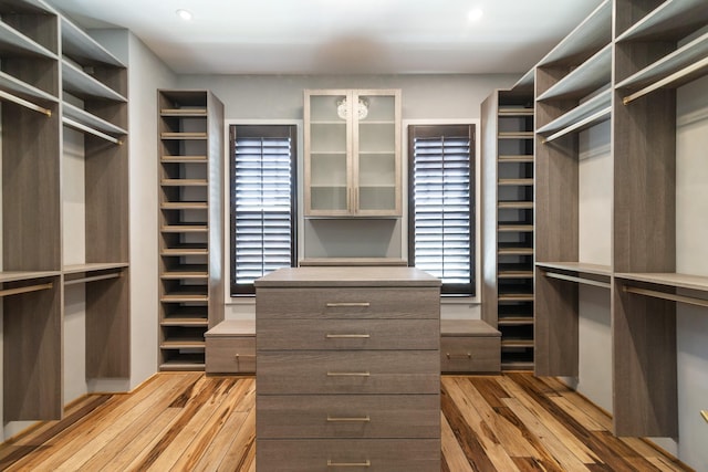 walk in closet featuring light hardwood / wood-style flooring