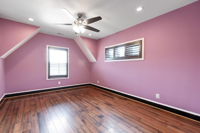 additional living space with dark wood-type flooring, ceiling fan, and vaulted ceiling