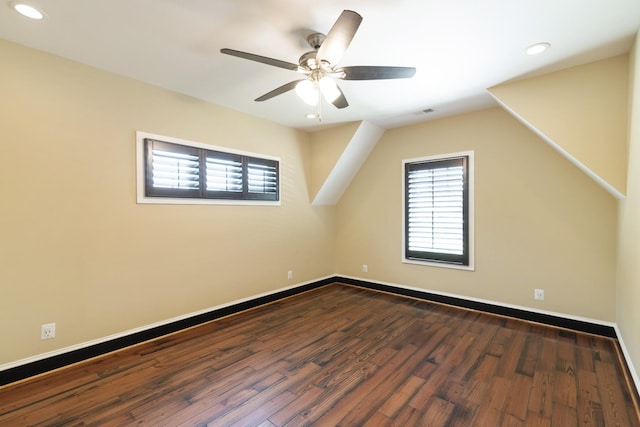 additional living space featuring dark wood-type flooring and ceiling fan