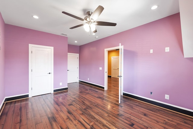 unfurnished bedroom with dark hardwood / wood-style floors and ceiling fan