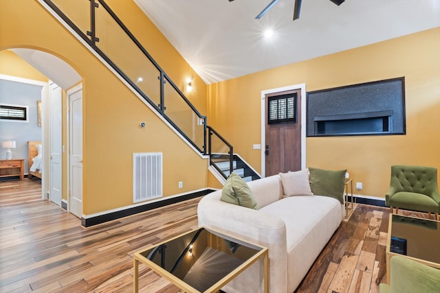 living room with hardwood / wood-style floors and ceiling fan