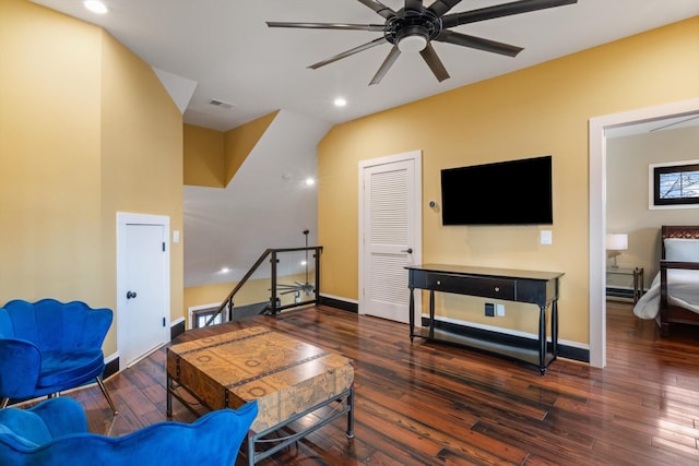 living room featuring dark hardwood / wood-style floors and ceiling fan