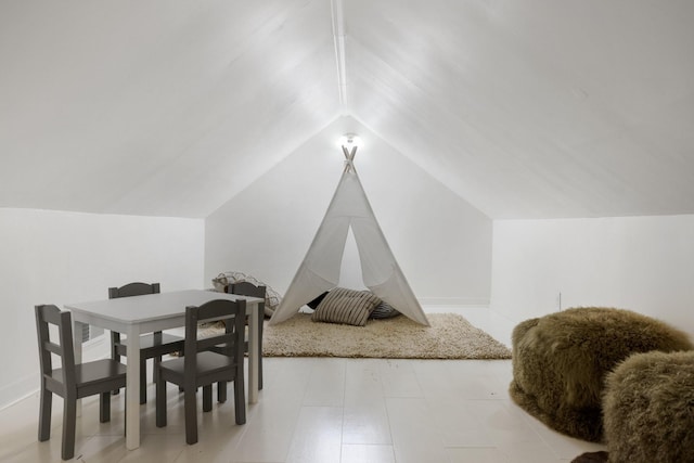 recreation room featuring lofted ceiling