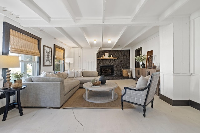 living room with a stone fireplace