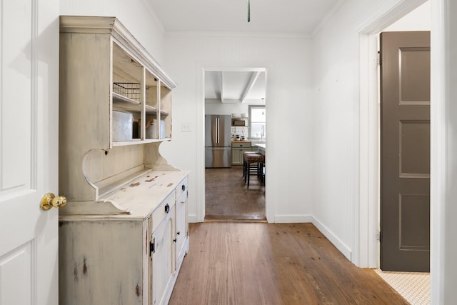 interior space featuring crown molding and light hardwood / wood-style floors