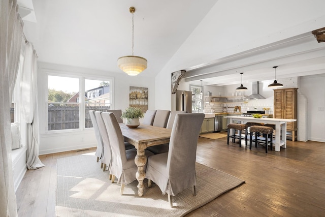 dining room with dark hardwood / wood-style floors and vaulted ceiling