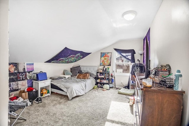 carpeted bedroom featuring vaulted ceiling