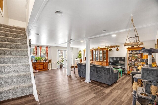 living room featuring hardwood / wood-style floors and ornate columns