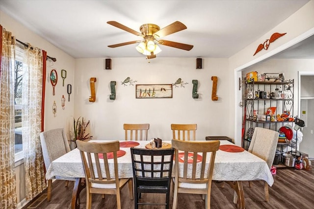 dining area featuring dark hardwood / wood-style floors and ceiling fan