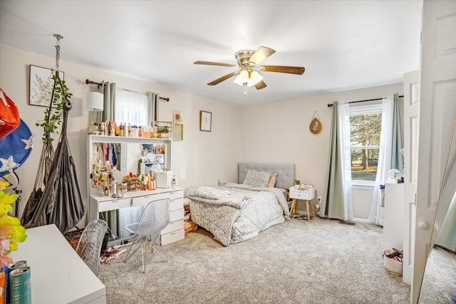 bedroom with ceiling fan and carpet floors