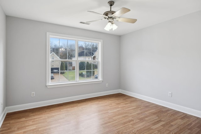 unfurnished room with ceiling fan and light hardwood / wood-style floors