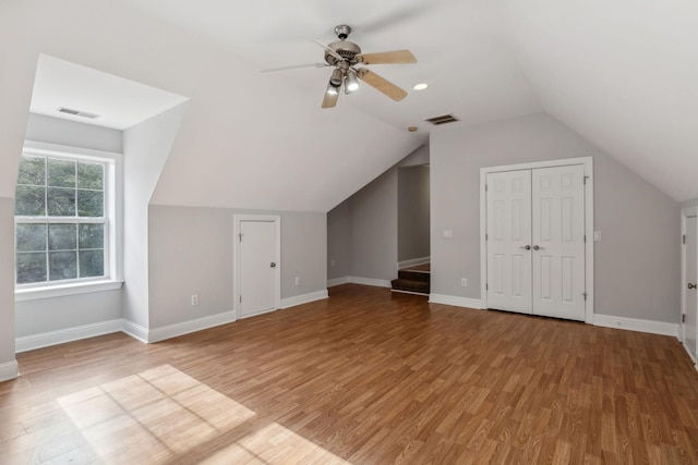 bonus room featuring wood-type flooring, ceiling fan, and vaulted ceiling