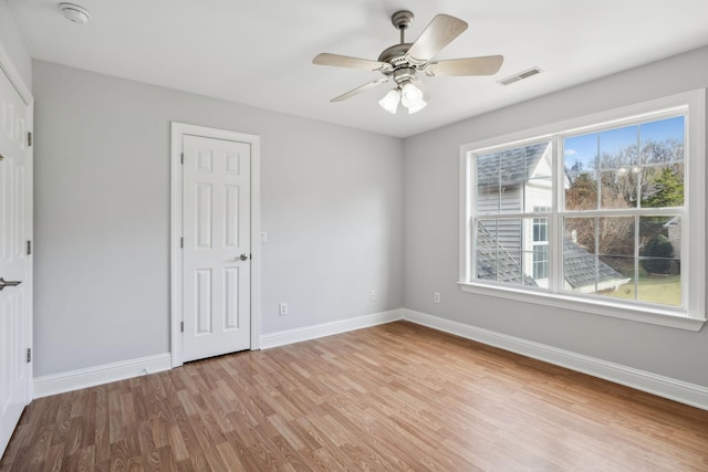 unfurnished room with ceiling fan and light hardwood / wood-style floors