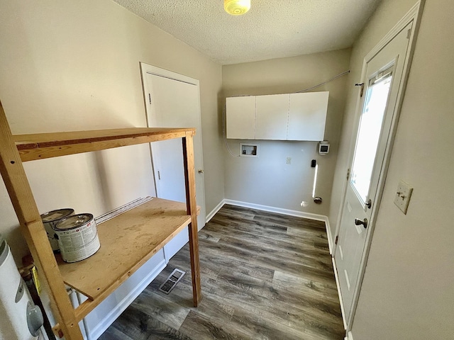 laundry room with cabinets, washer hookup, dark hardwood / wood-style flooring, and a textured ceiling