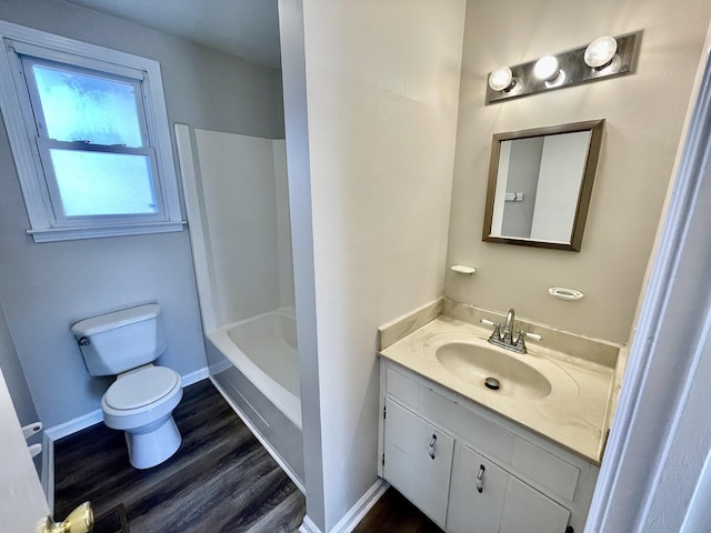 full bathroom featuring vanity, wood-type flooring,  shower combination, and toilet