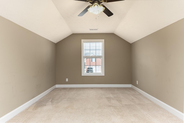 bonus room featuring vaulted ceiling, light colored carpet, and ceiling fan