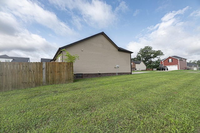 view of home's exterior with a lawn