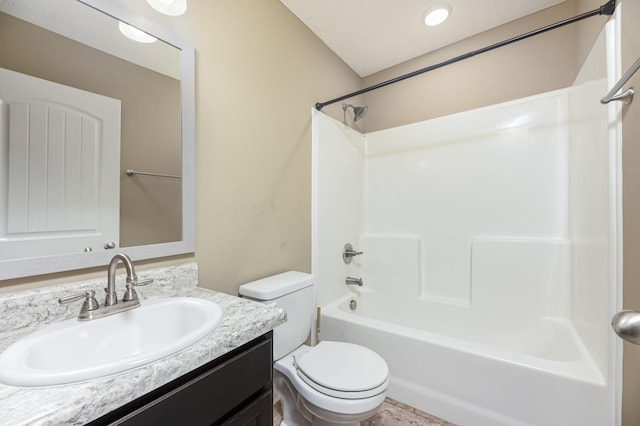 full bathroom with vanity, tub / shower combination, and toilet